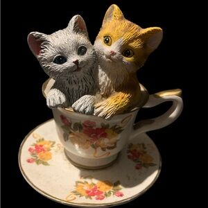 Vintage two kittens sitting in floral teacup and saucer